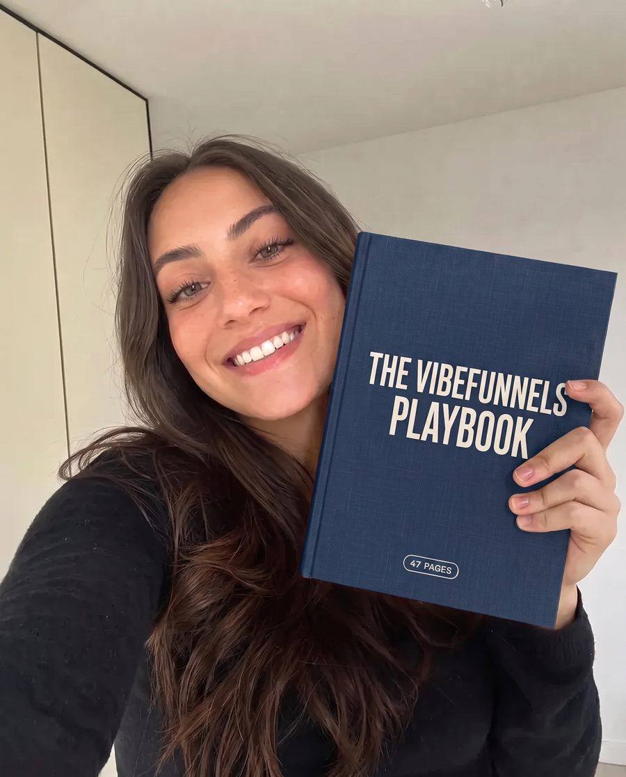 The VibeFunnels Playbook at a desk