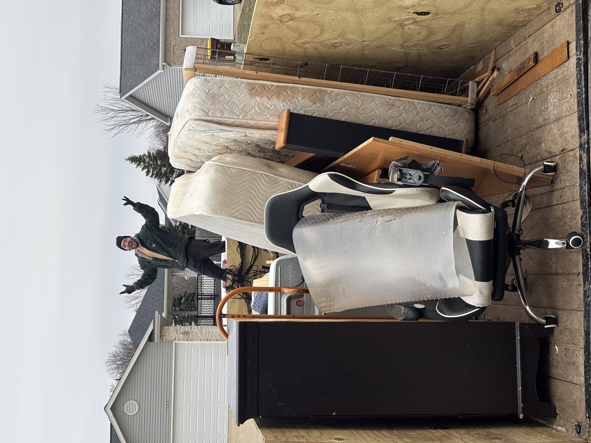 Bluewater Junk Removal crew hauling junk in Grand Rapids