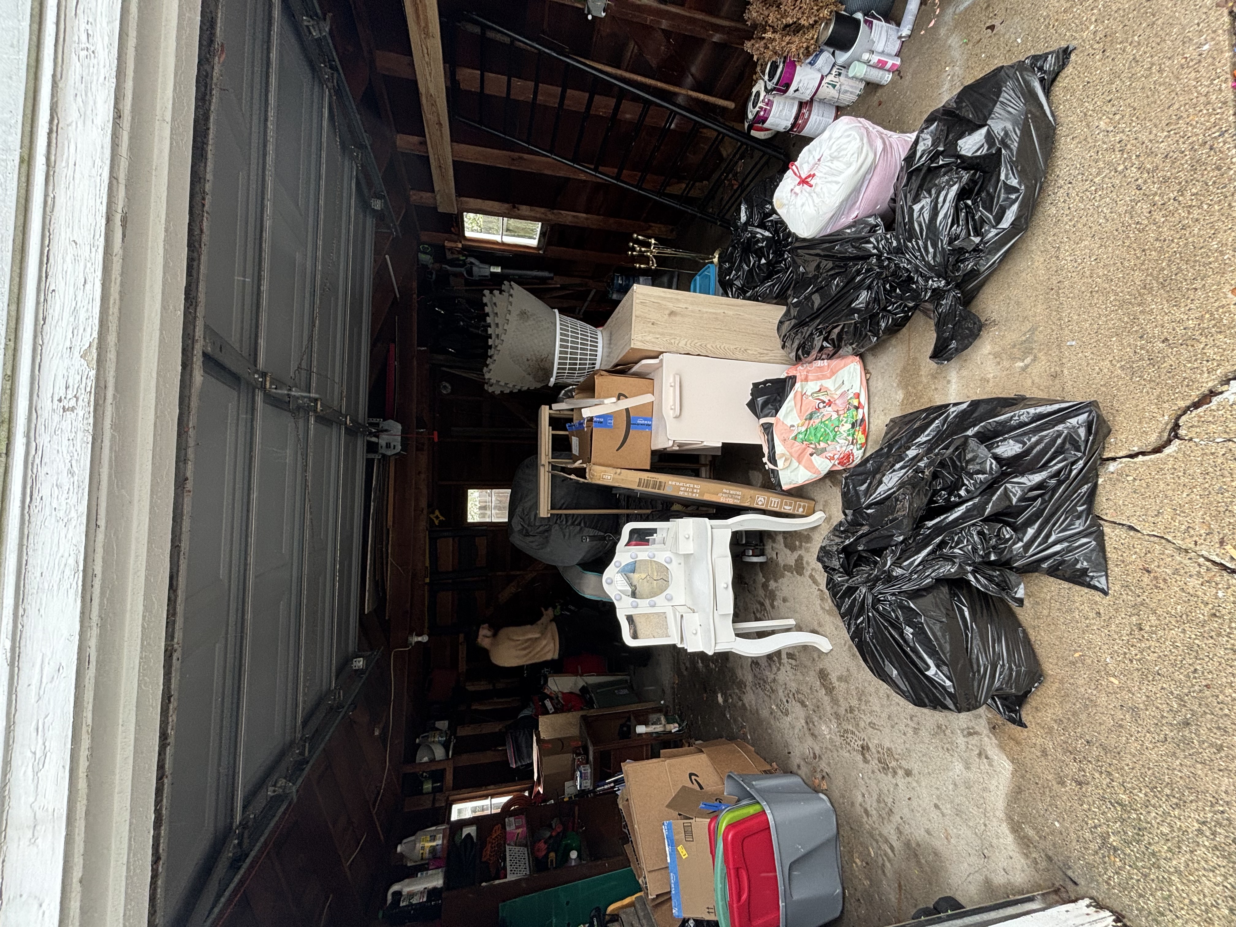 Cluttered garage before junk removal