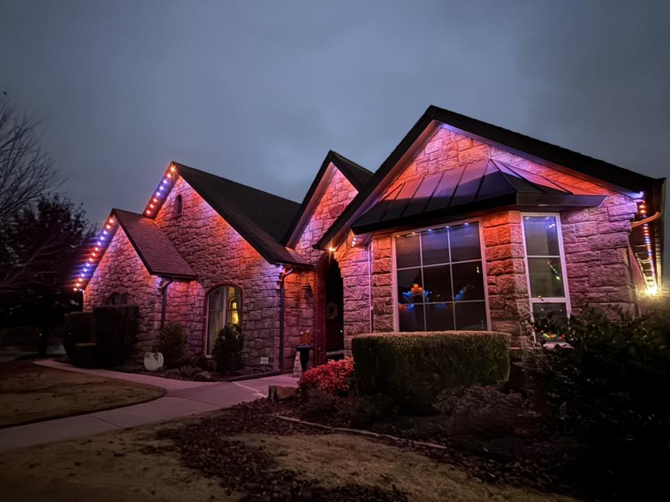 Permanent LED roofline lighting on a commercial building at night