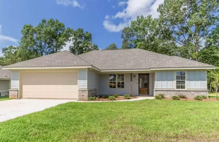Completed single story home with brick accents and a two car garage