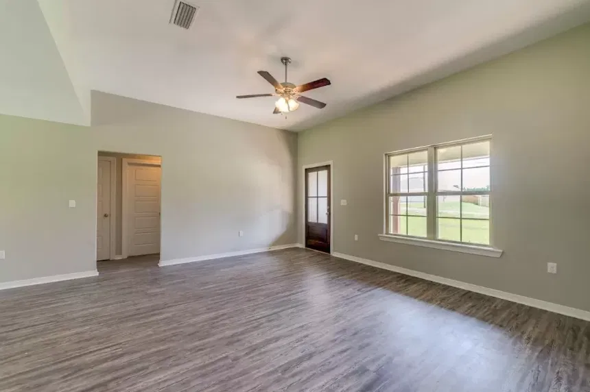 Open living room with plank flooring