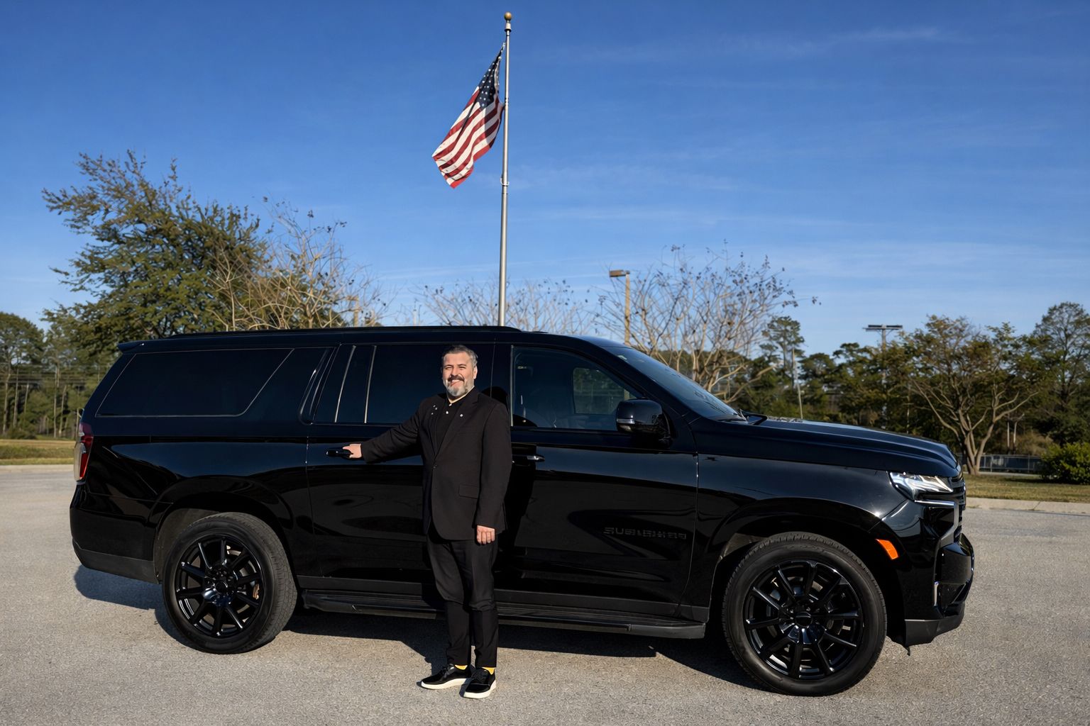Koray owner and professional chauffeur with luxury Chevrolet Suburban