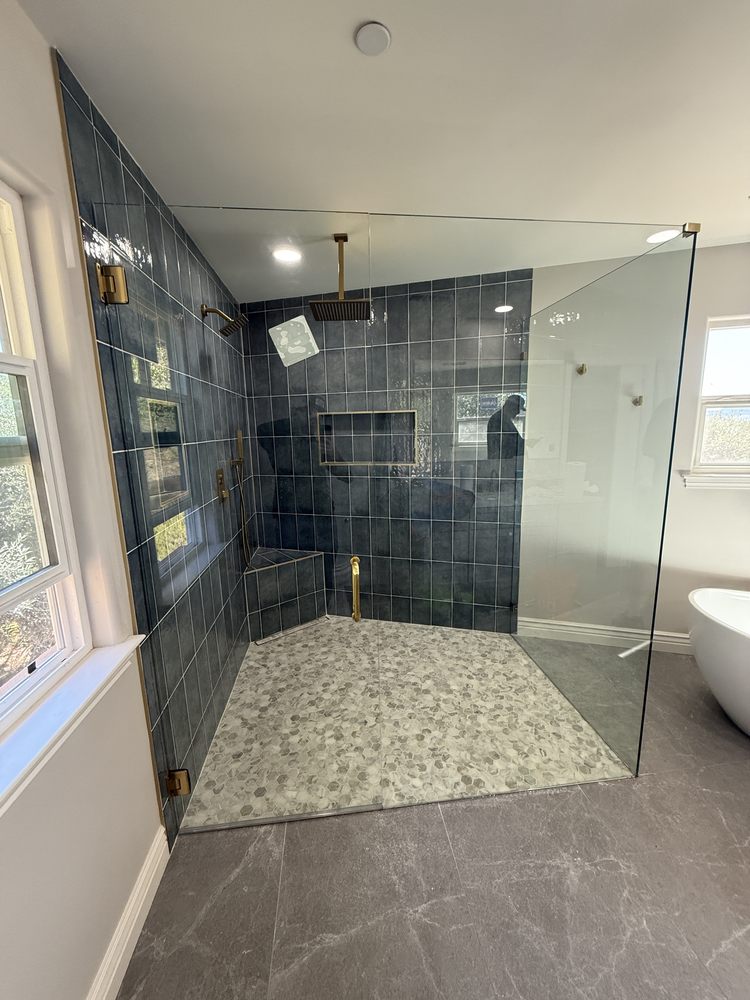 Walk-in glass shower enclosure installed by Crockett Rodeo Glass in Rodeo, CA
