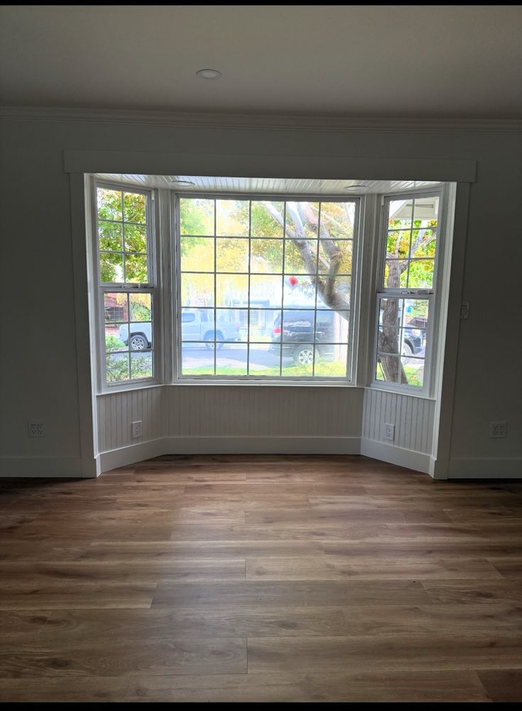 Bay window with grid panes installed in a remodeled living room