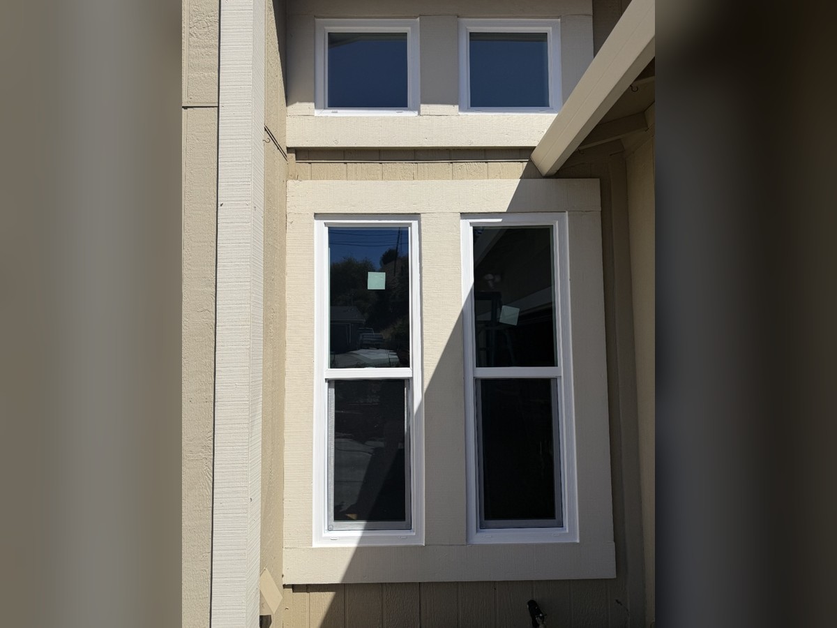 Double-hung replacement windows with transom windows above