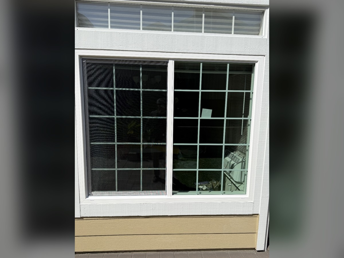 Sliding window with grids and a transom window above