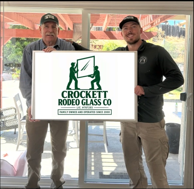 Crockett Rodeo Glass Co family team holding the company sign