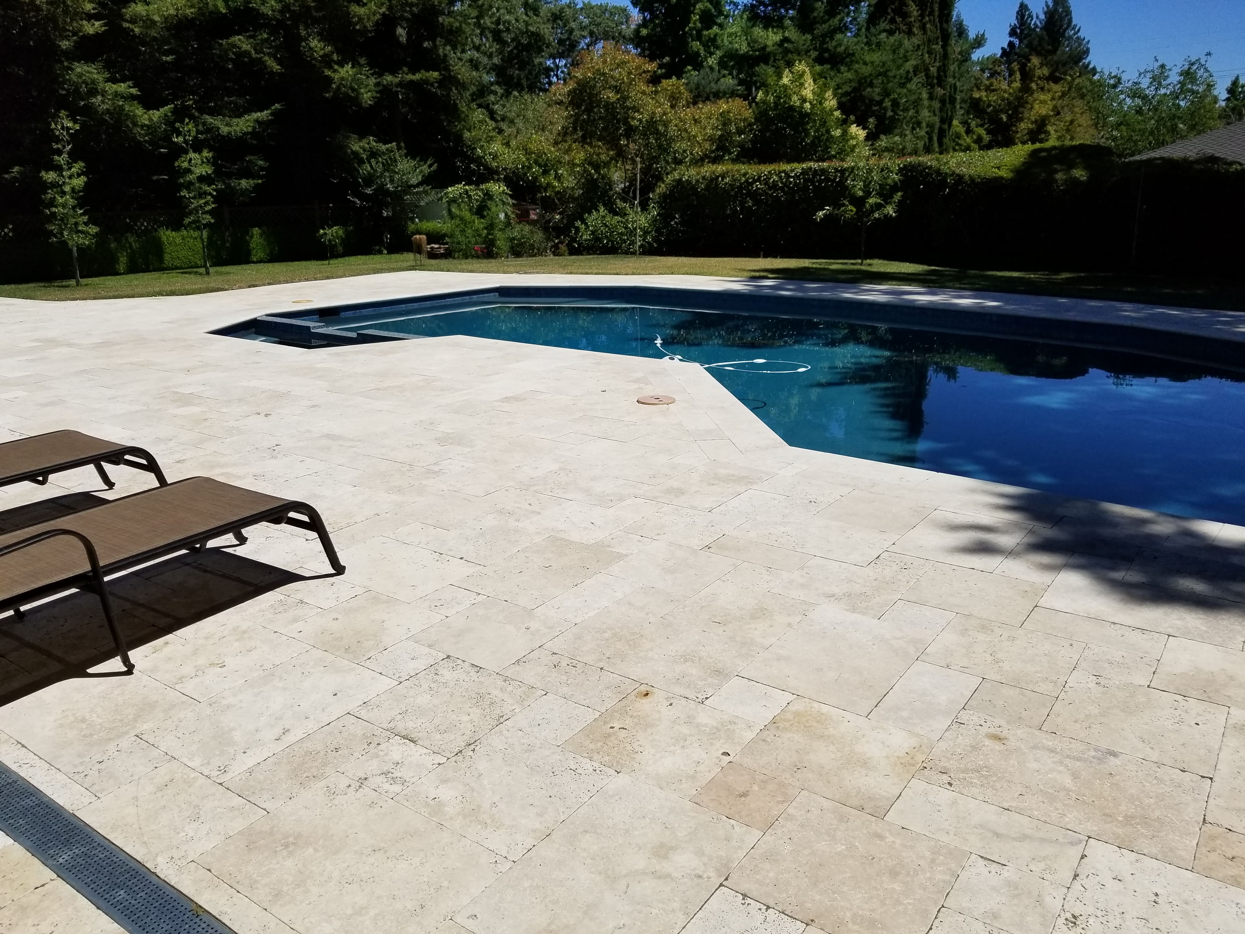 Retaining wall and paver driveway at a Mediterranean-style home in Brentwood, CA - Paradise Building Materials project
