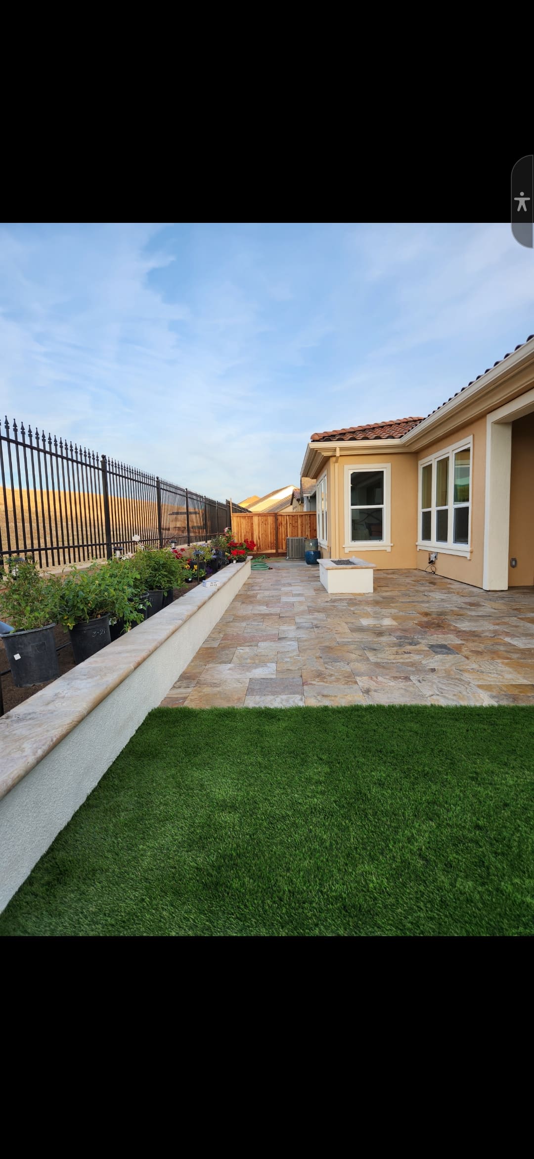Backyard paver patio with outdoor seating and fire pit area - hardscape from Paradise Building Materials