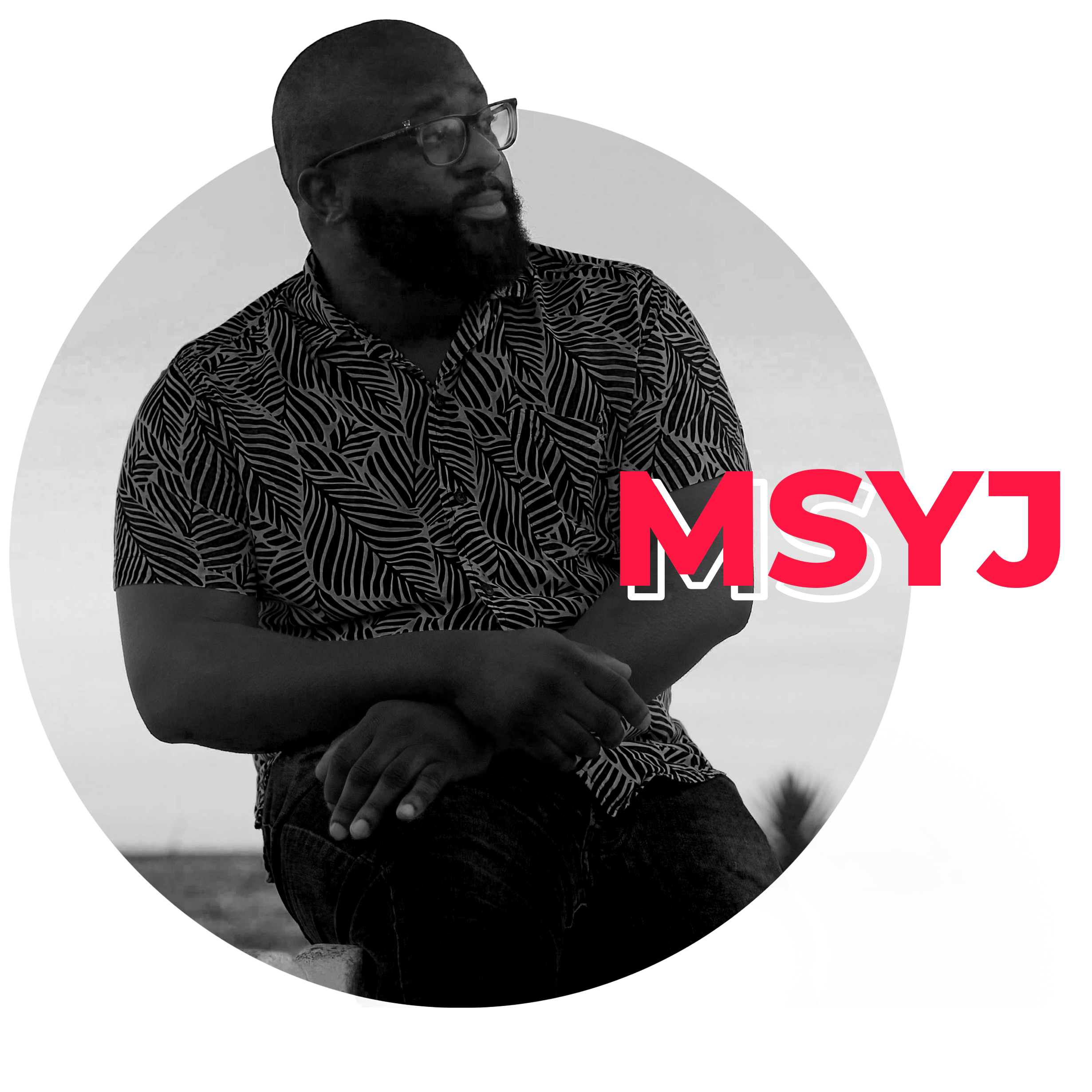 Black and white portrait of MSYJ seated outdoors