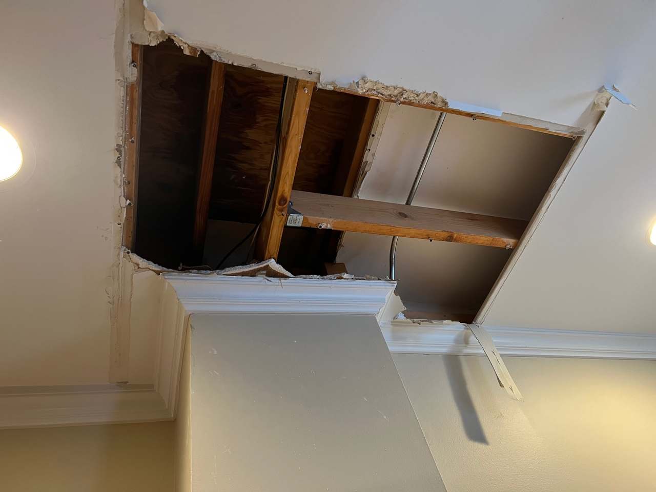 Ceiling opening with exposed framing in an interior room