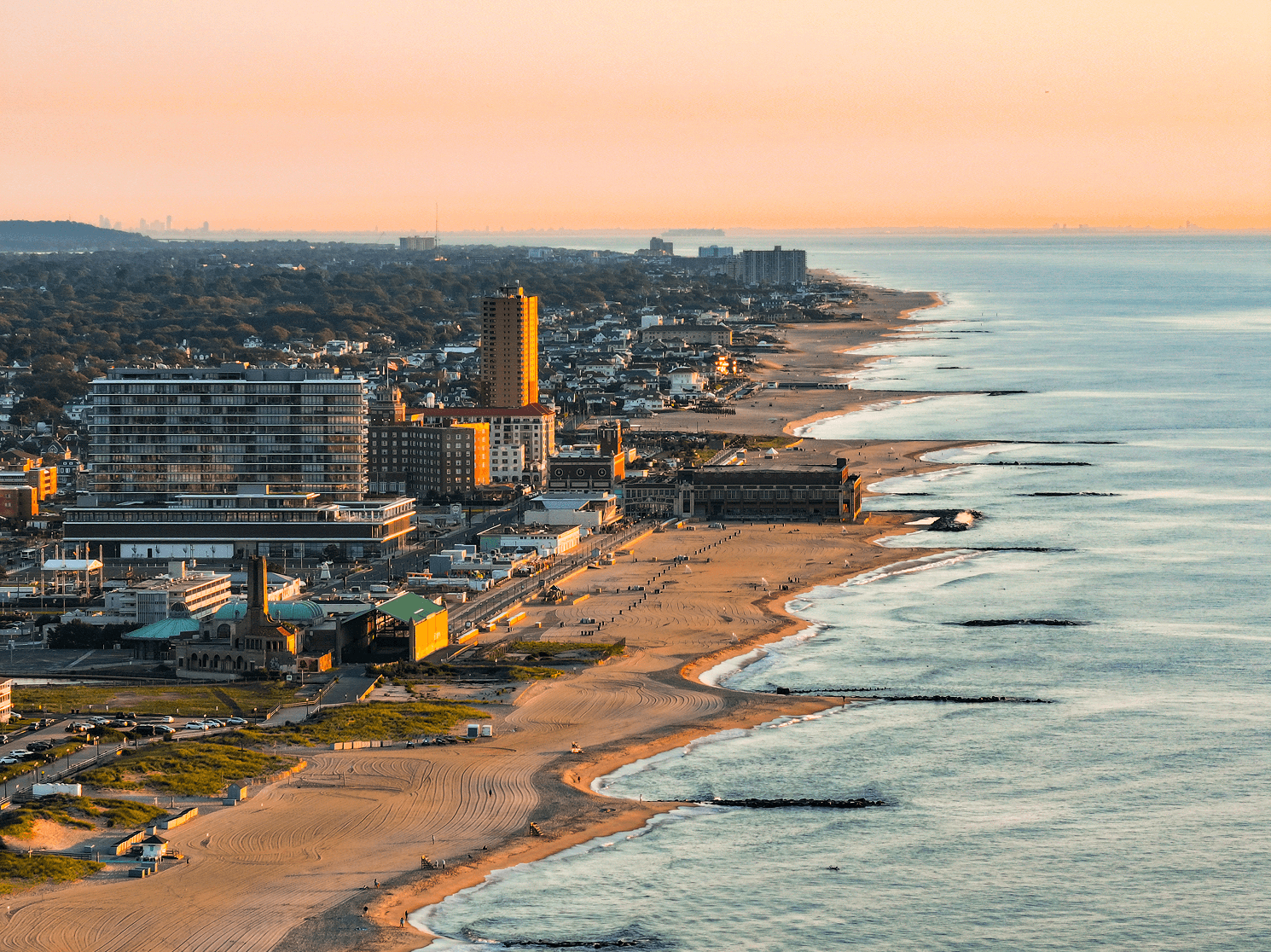 Aerial view of a New Jersey shore town and beachfront at sunset