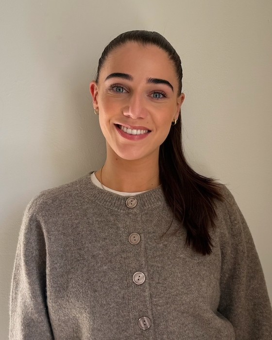 Dr Ella Solomon, HCPC-registered Clinical Psychologist, smiling