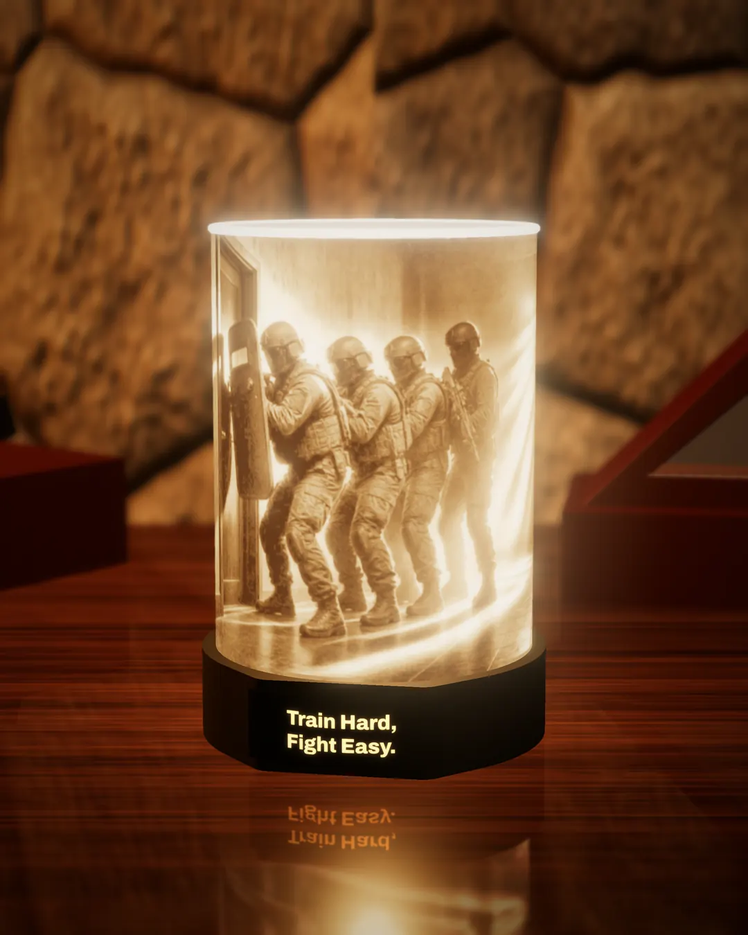 SWAT tribute lithophane lamp lit warm, showing a SWAT team stacked at a doorway, with the black base nameplate glowing “Train Hard, Fight Easy.”, on a wooden desk against a stone wall