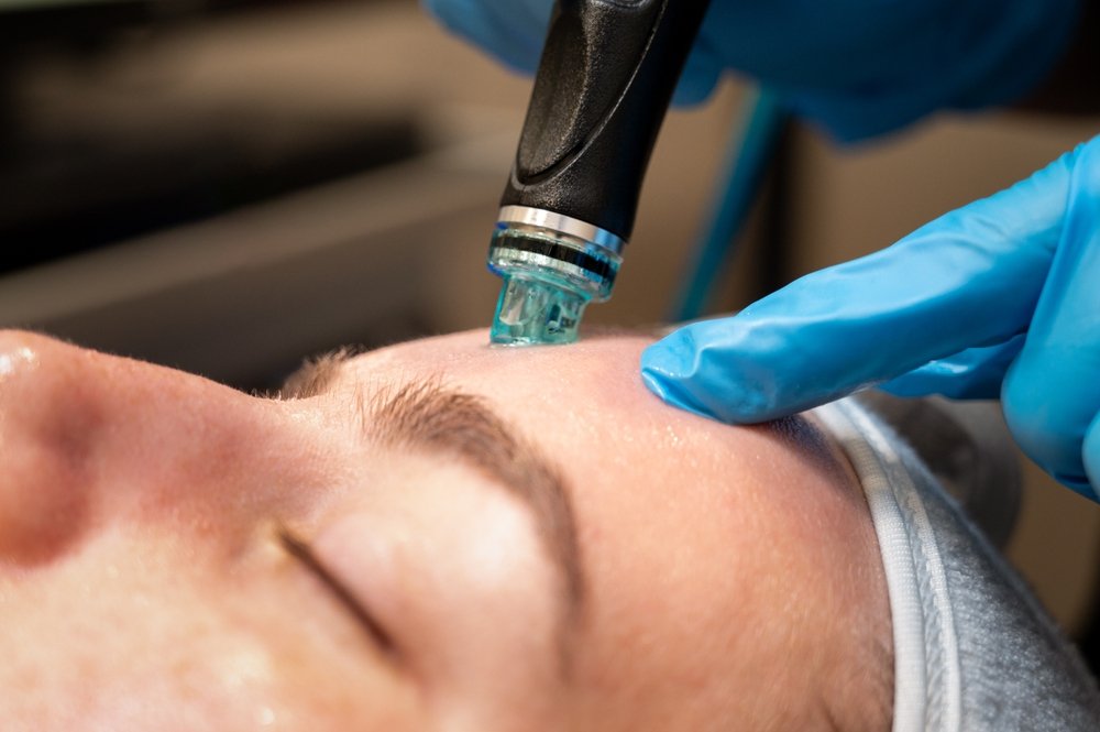 Client relaxing during a Radiance Reveal treatment at Rejuvenate Renew