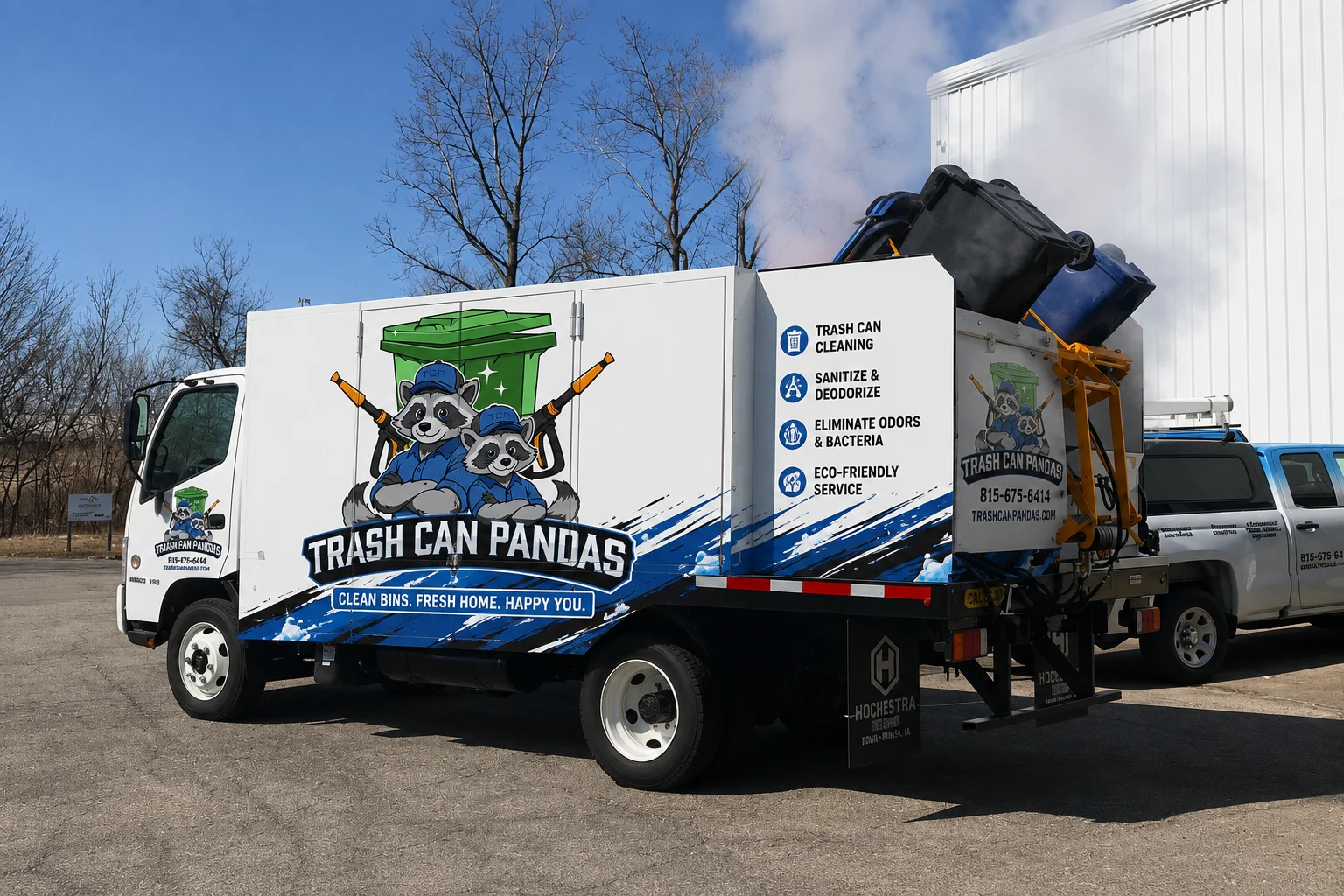 A white 'Trash Can Pandas' cleaning truck with raccoon mascots and service details, displaying bins being cleaned.