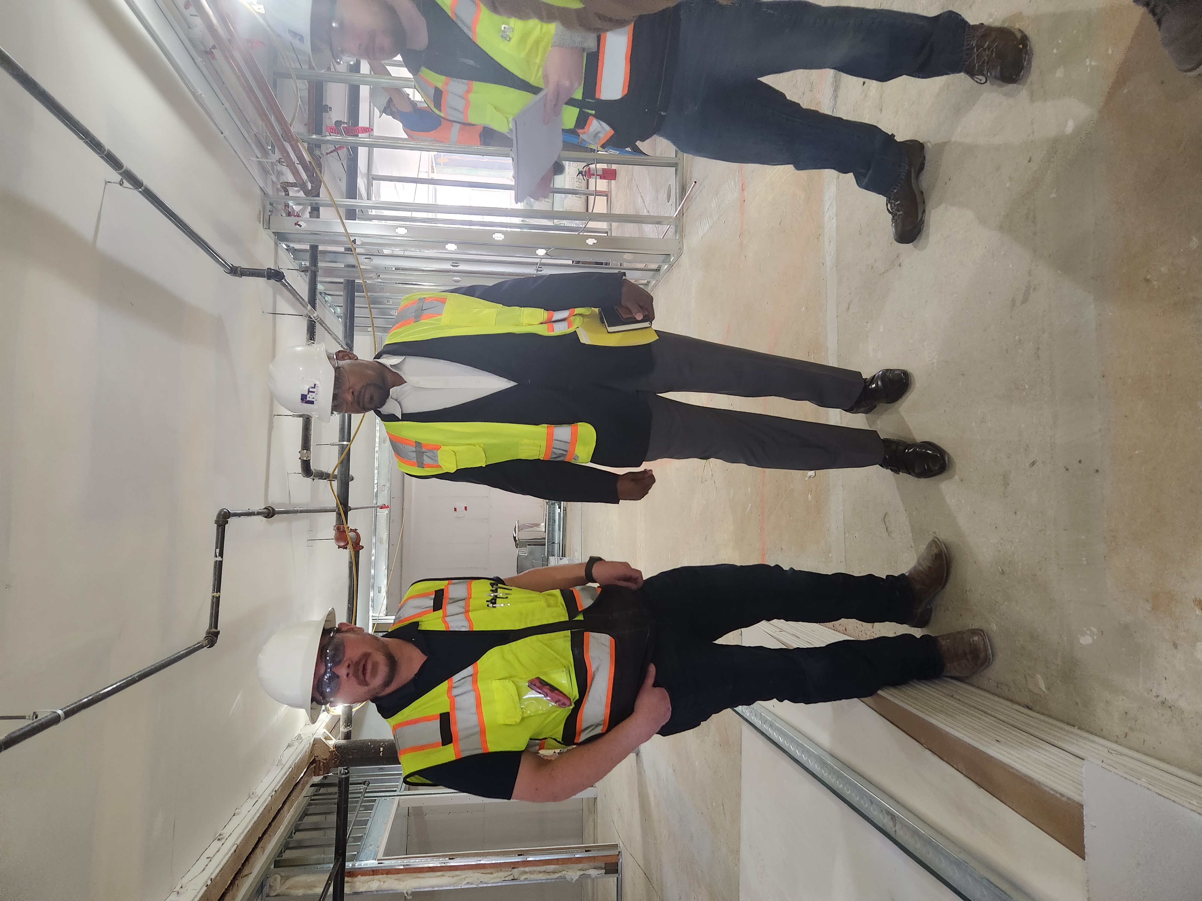 RTL Foundation team in hard hats at the 2900 Welton Street building