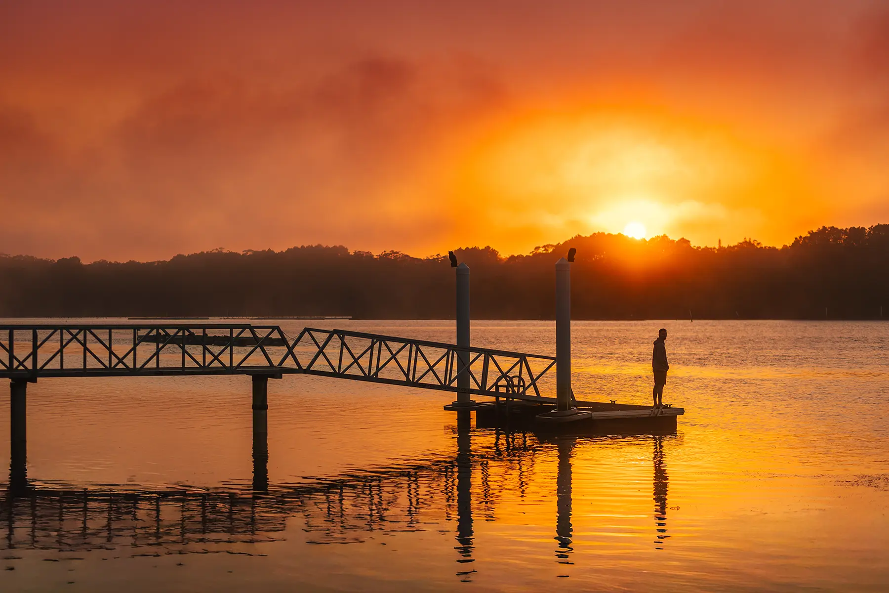 Riverfront cabin dining area with river views, Nambucca Heads