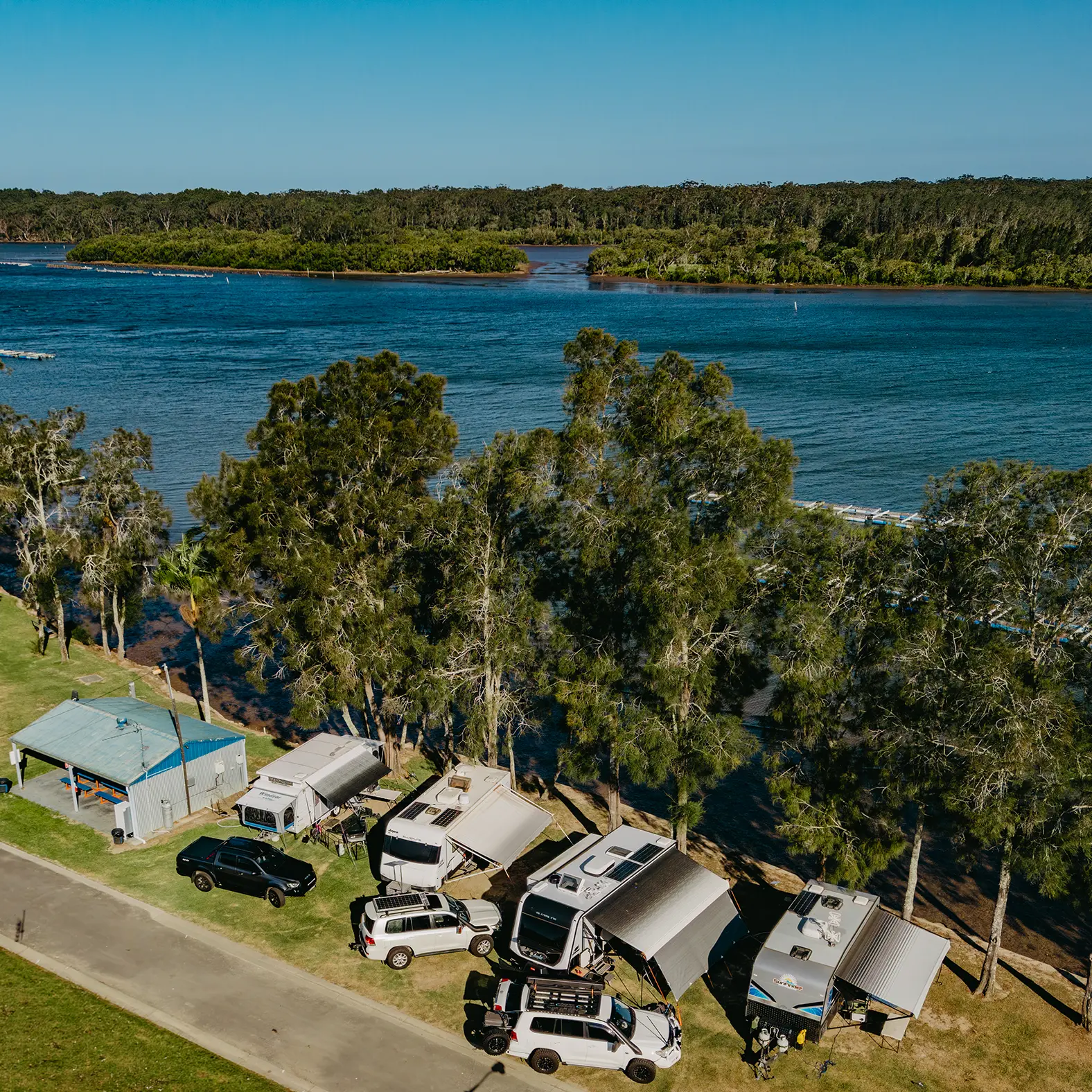 Riverfront cabin dining area with river views, Nambucca Heads