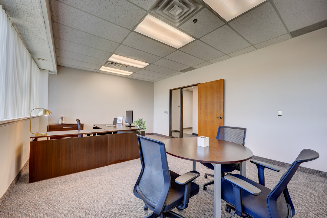 Conference-style seating within a private office