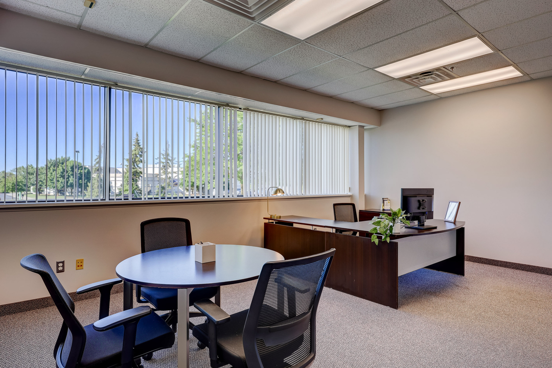 Private office configured for client meetings