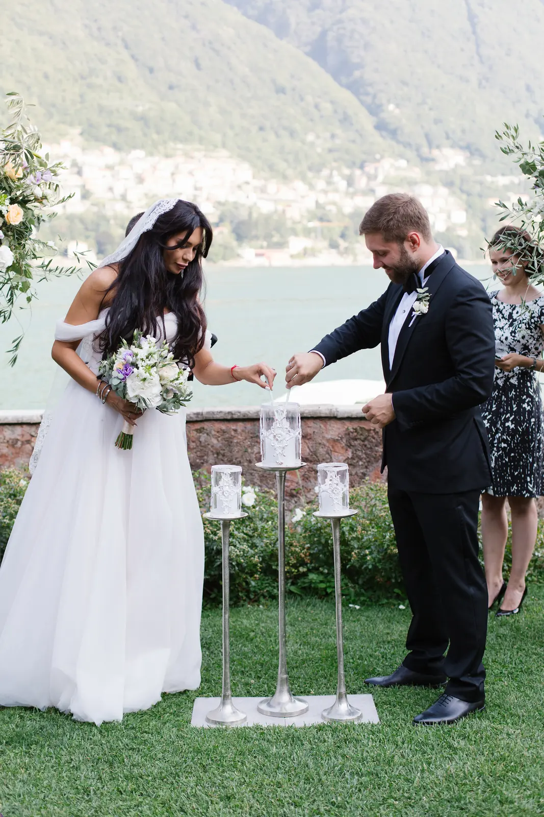 A bride smiling and relaxed on a terrace in Italy, looking at the landscape before her wedding