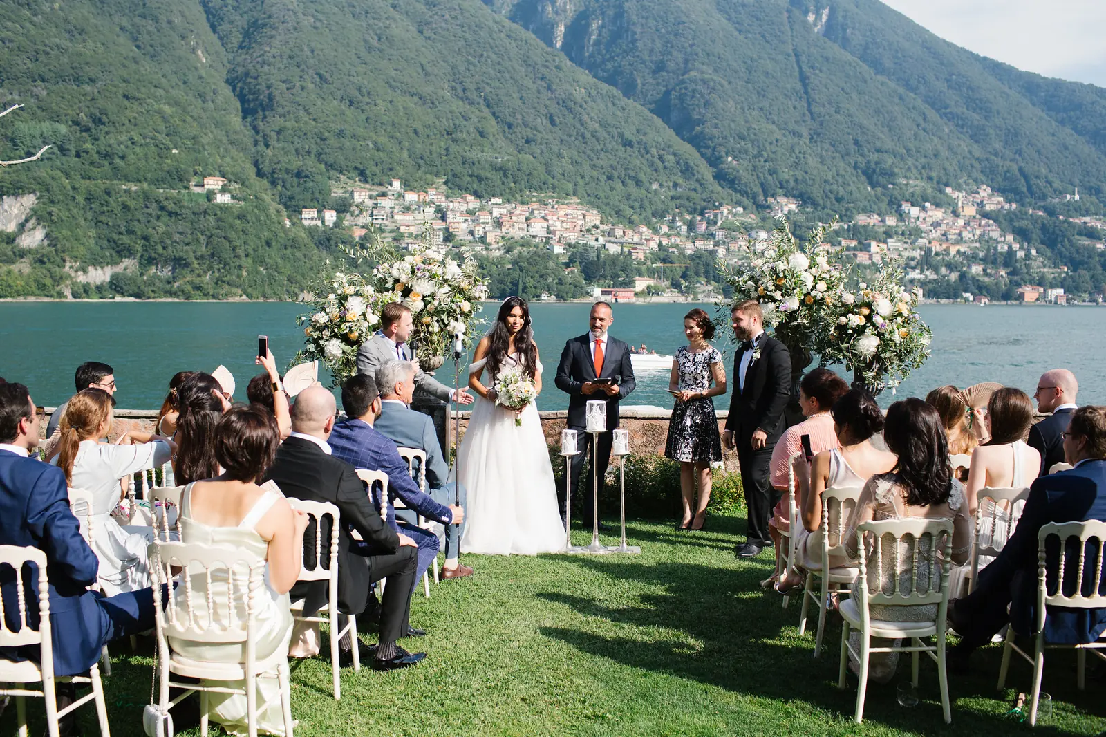 Intimate wedding dinner on a terrace overlooking Lake Como at sunset