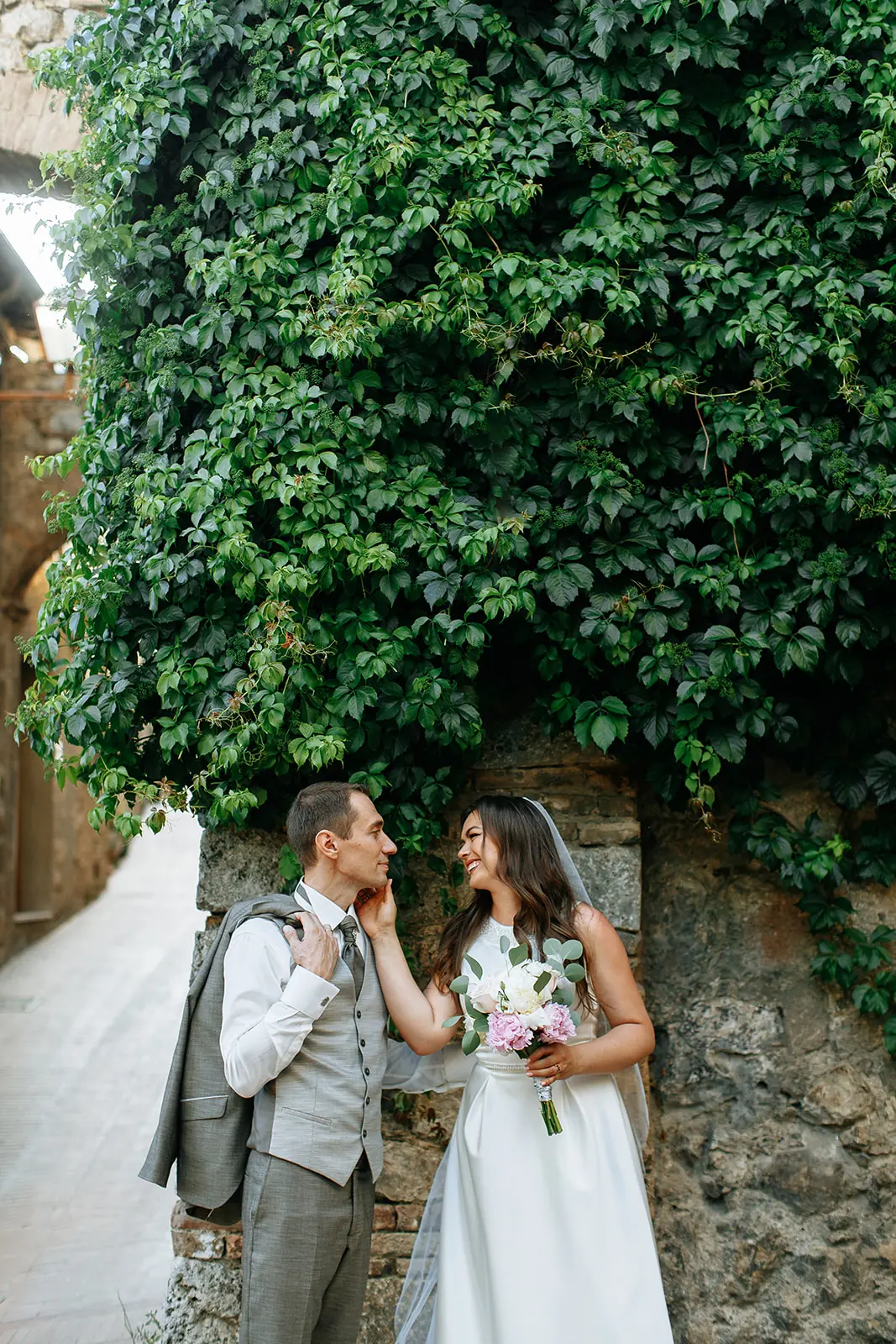 Historic castle among the Tuscan hills prepared for an intimate wedding ceremony