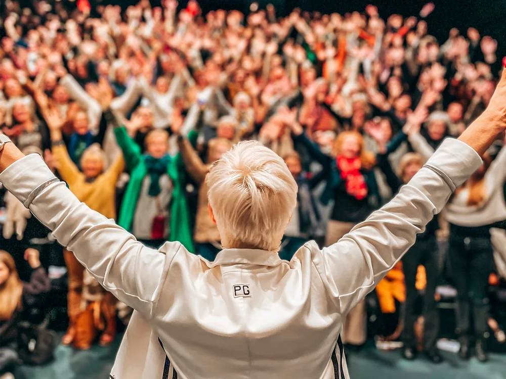 Inge Rock on stage inspiring an audience