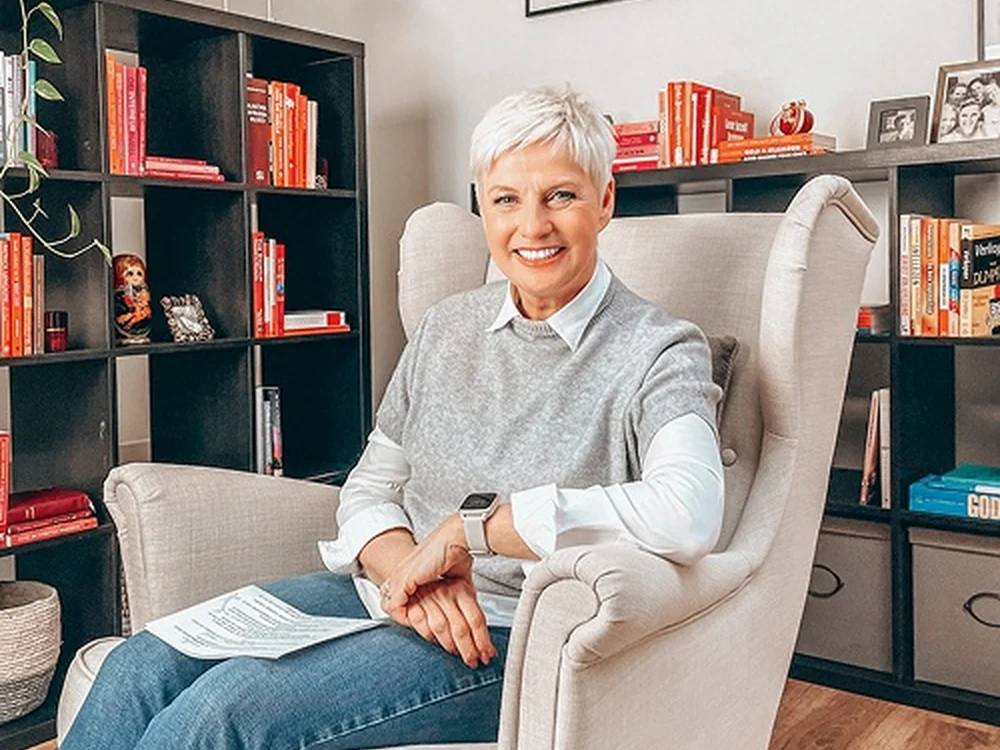 Inge Rock in her armchair reading and reflecting