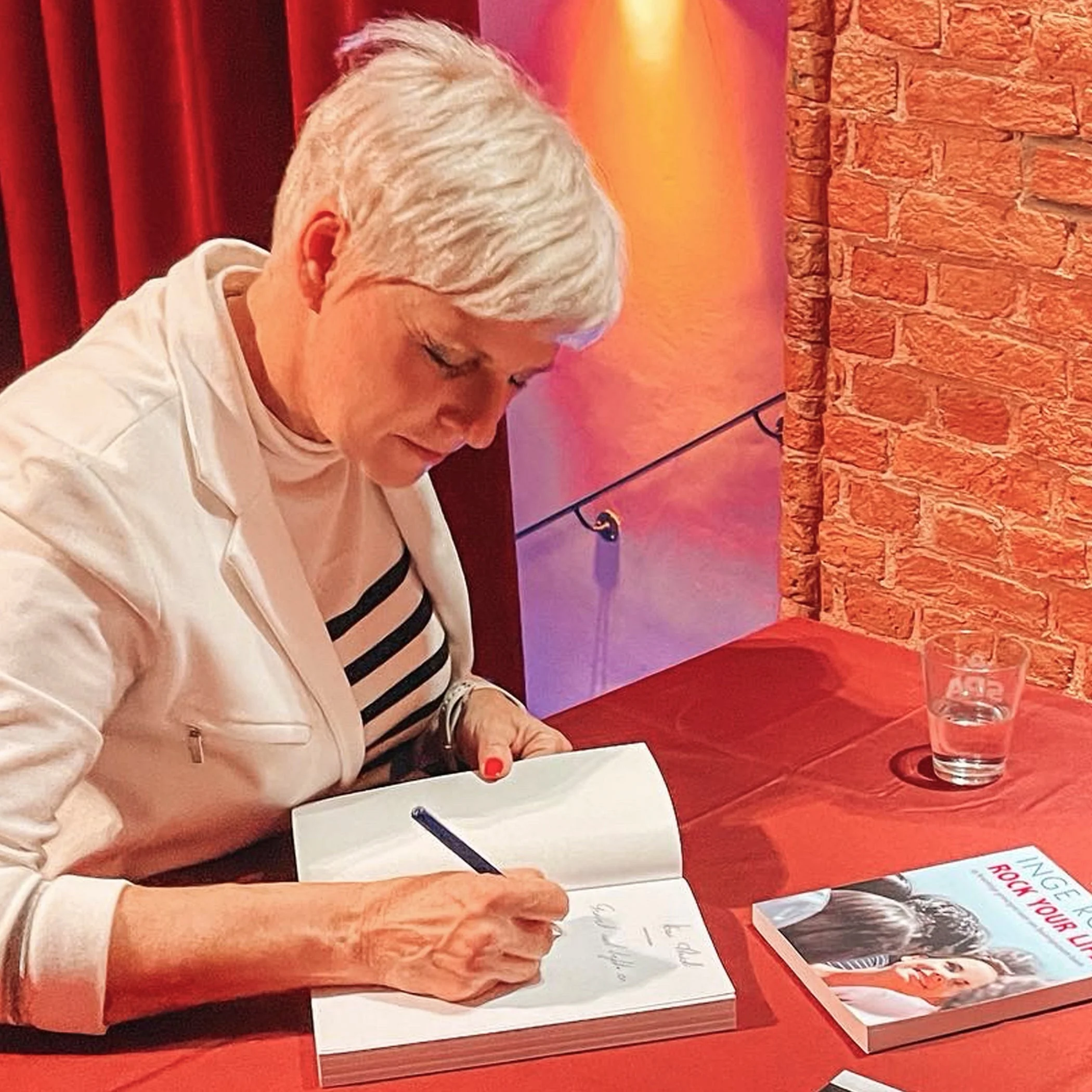 Inge Rock — Author and Keynote Speaker Inge Rock signing books