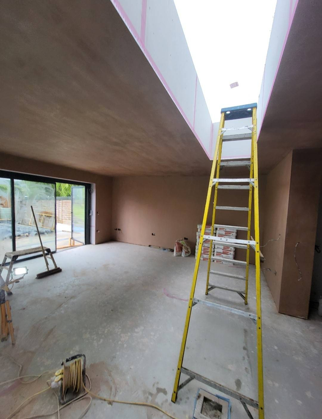 Smooth, freshly plastered interior with clean walls and ceiling — TGW Plastering Contractors