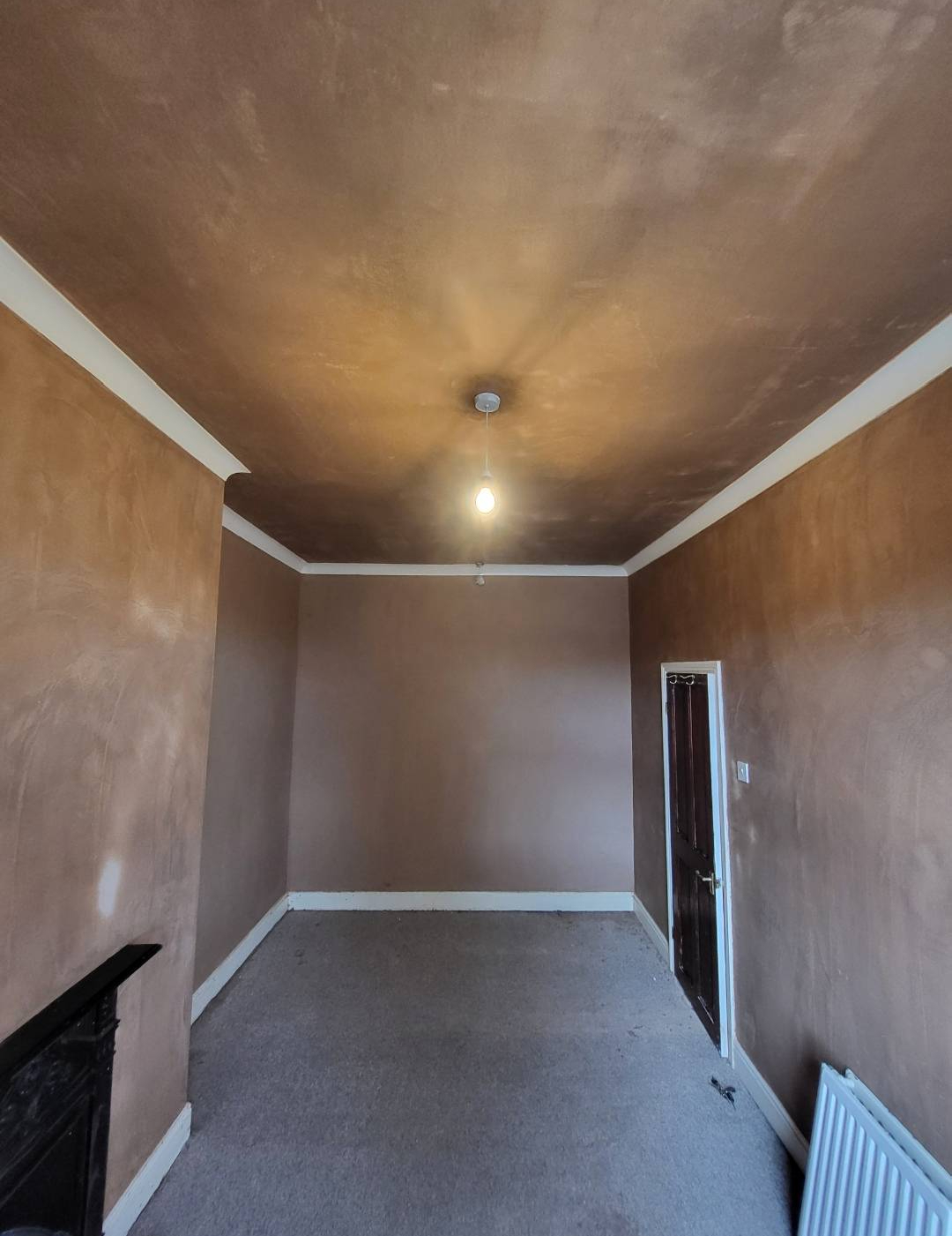 Plastered domestic room with smooth walls and ceiling