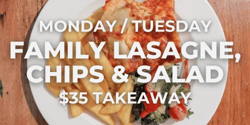 Traditional lasagne with chips and salad