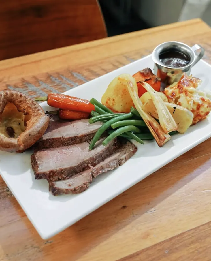 Roast beef with Yorkshire pudding, roast potatoes and vegetables