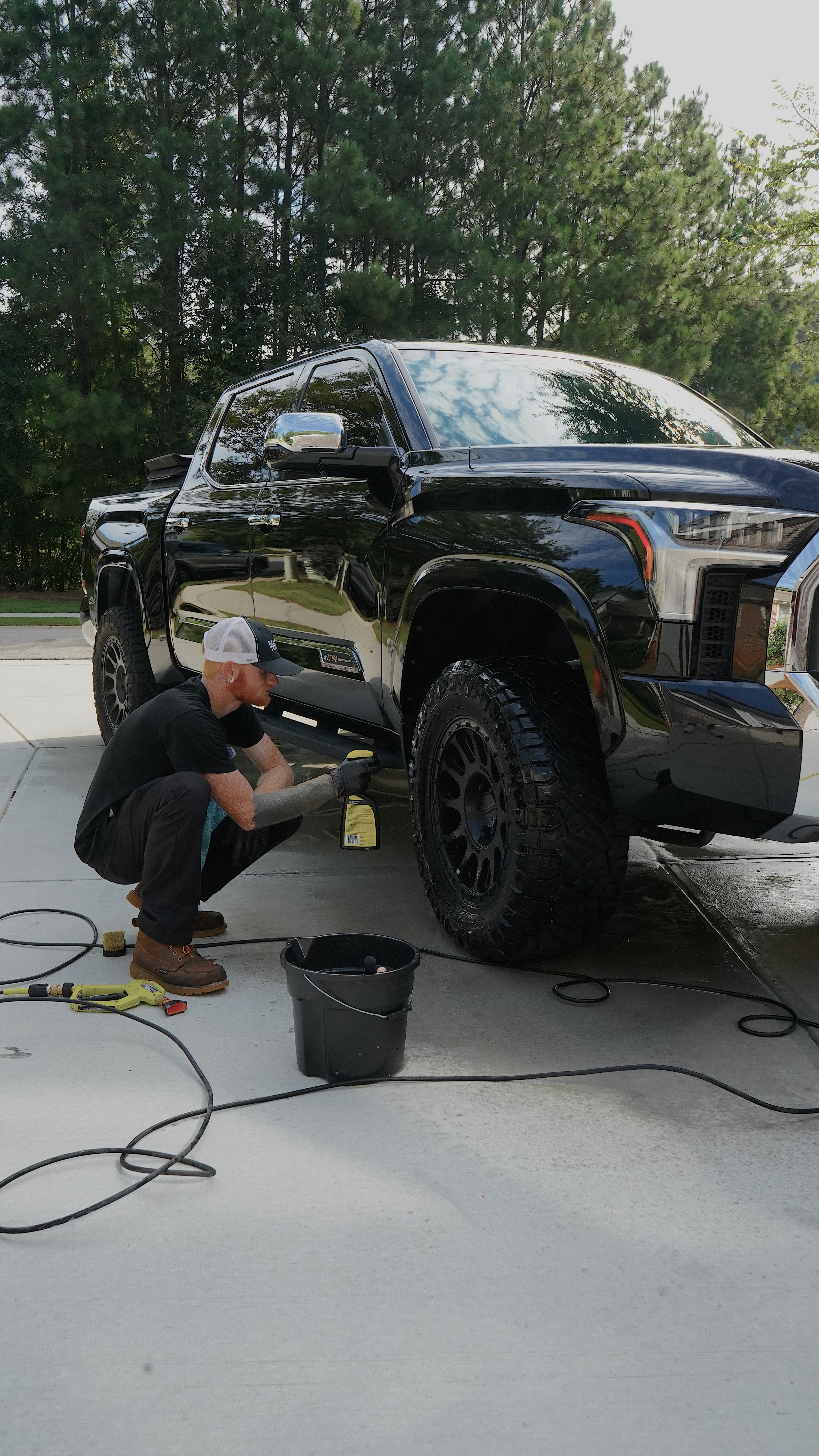 Vehicle receiving professional ceramic coating and paint enhancement