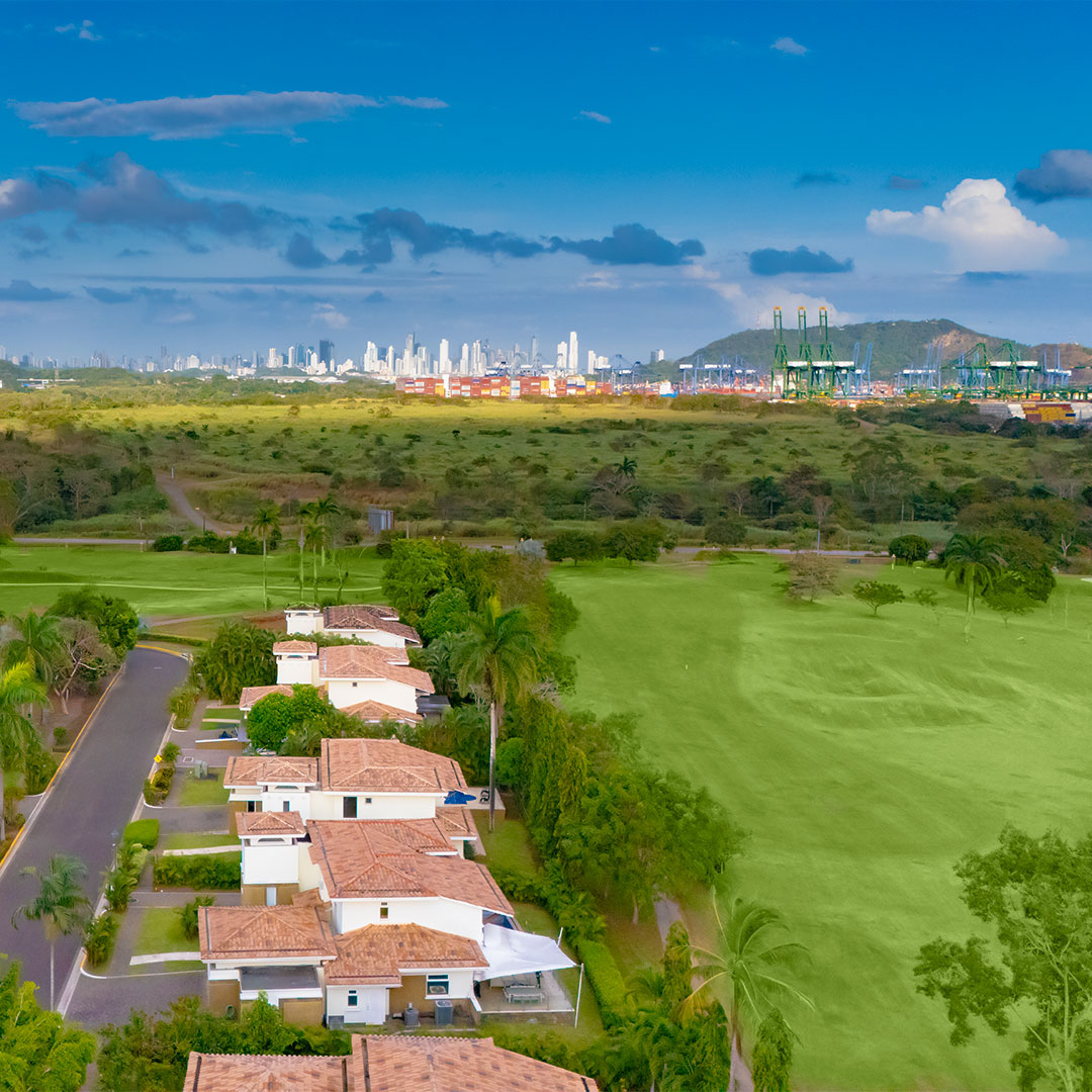 Aerial view of villas beside the golf course and Panama Canal