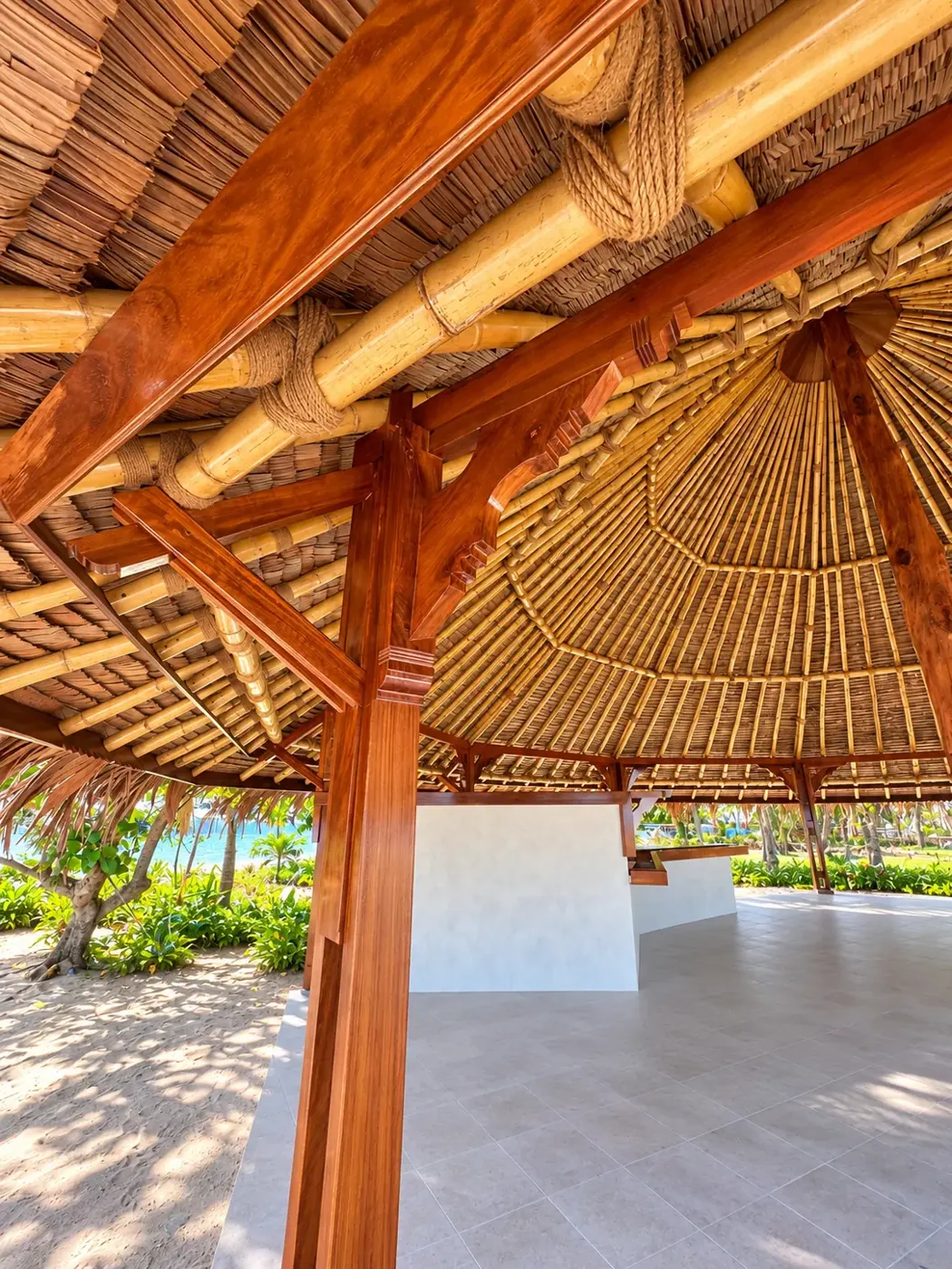 Timber and bamboo joinery beneath the beachfront gazebo roof