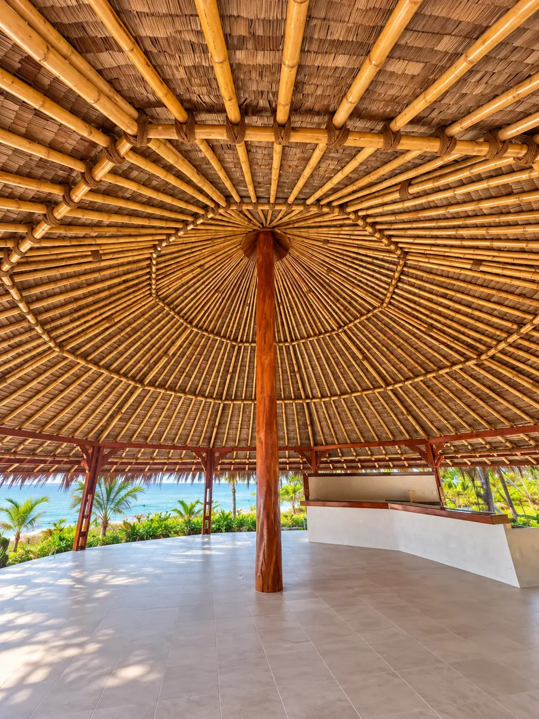 The circular palm roof and open interior of the beachfront gazebo