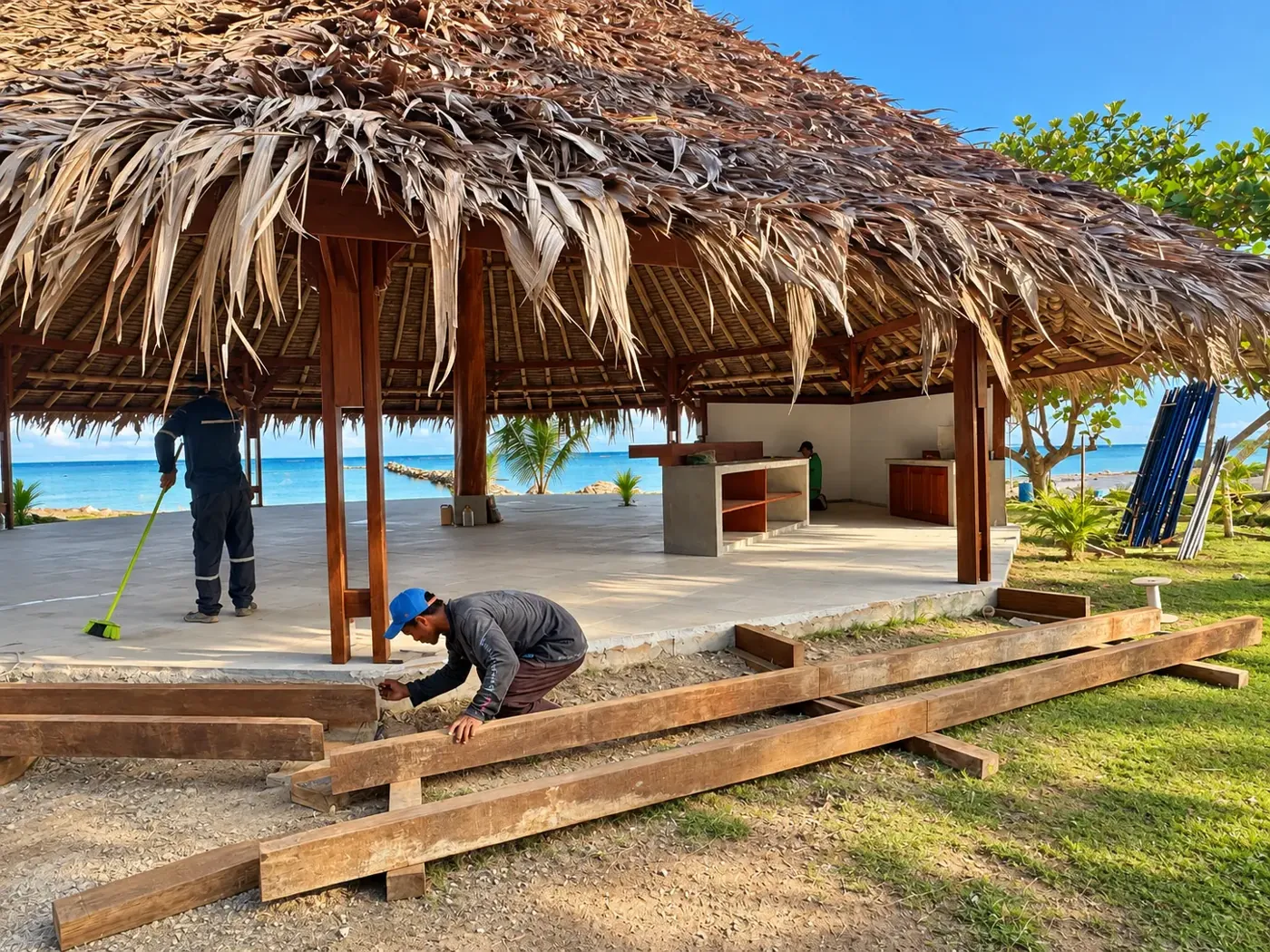 Craftsmen completing the timber edge of the beachfront gazebo