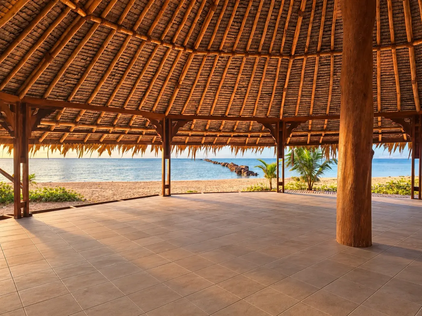 Interior of the palm-thatched gazebo open toward the Caribbean Sea