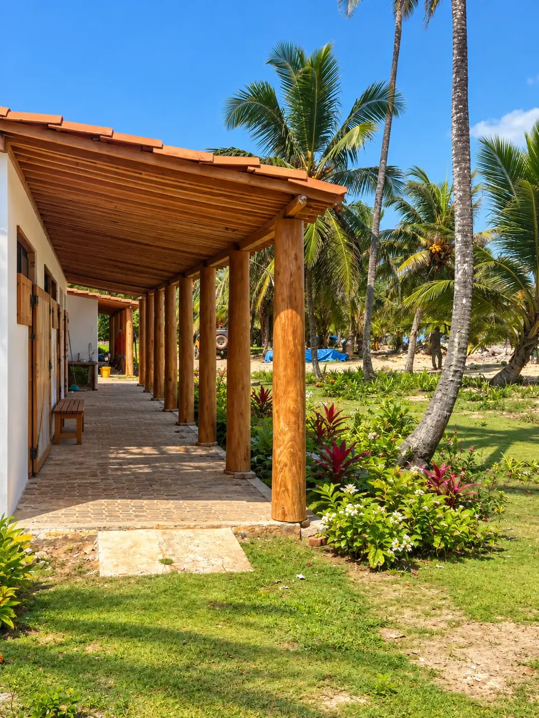 Timber veranda and garden beside the beachfront villas