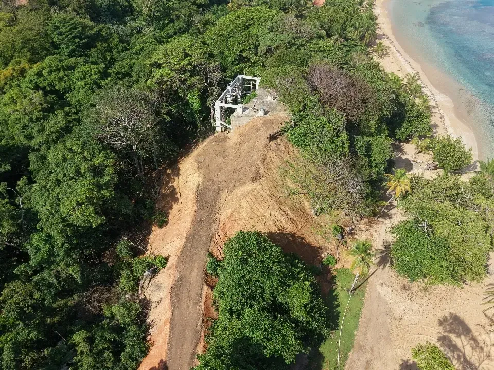 Concrete lodge structure set high above the sea