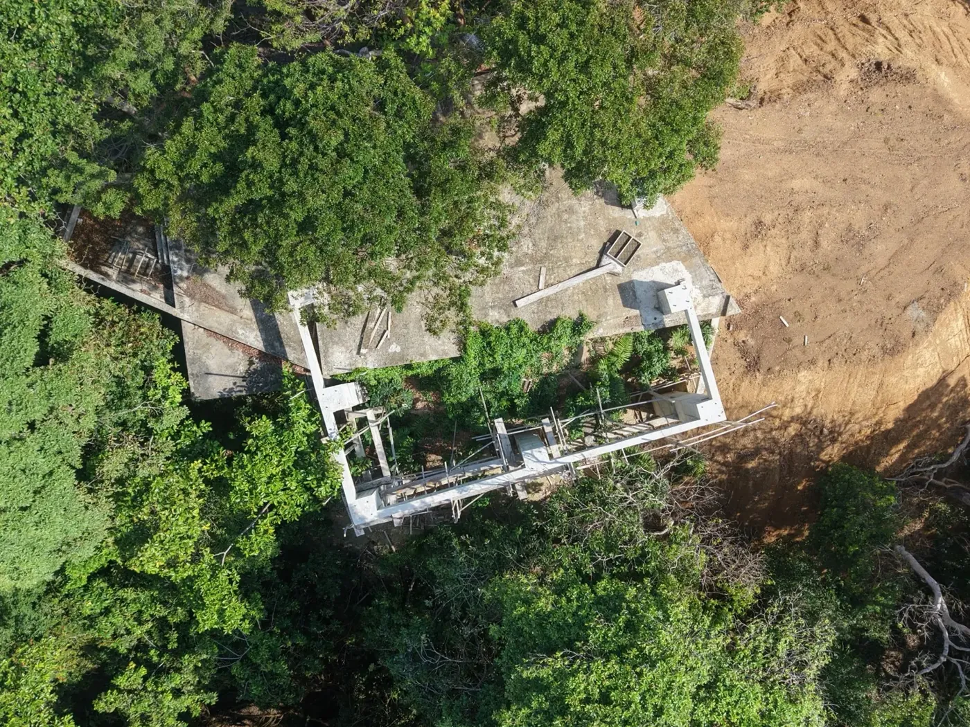 Aerial view of the future lodge site surrounded by tropical forest