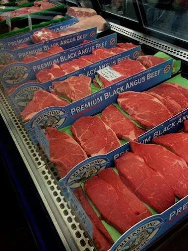 Packaged steaks in the refrigerated beef case at Jordan Meats & Deli