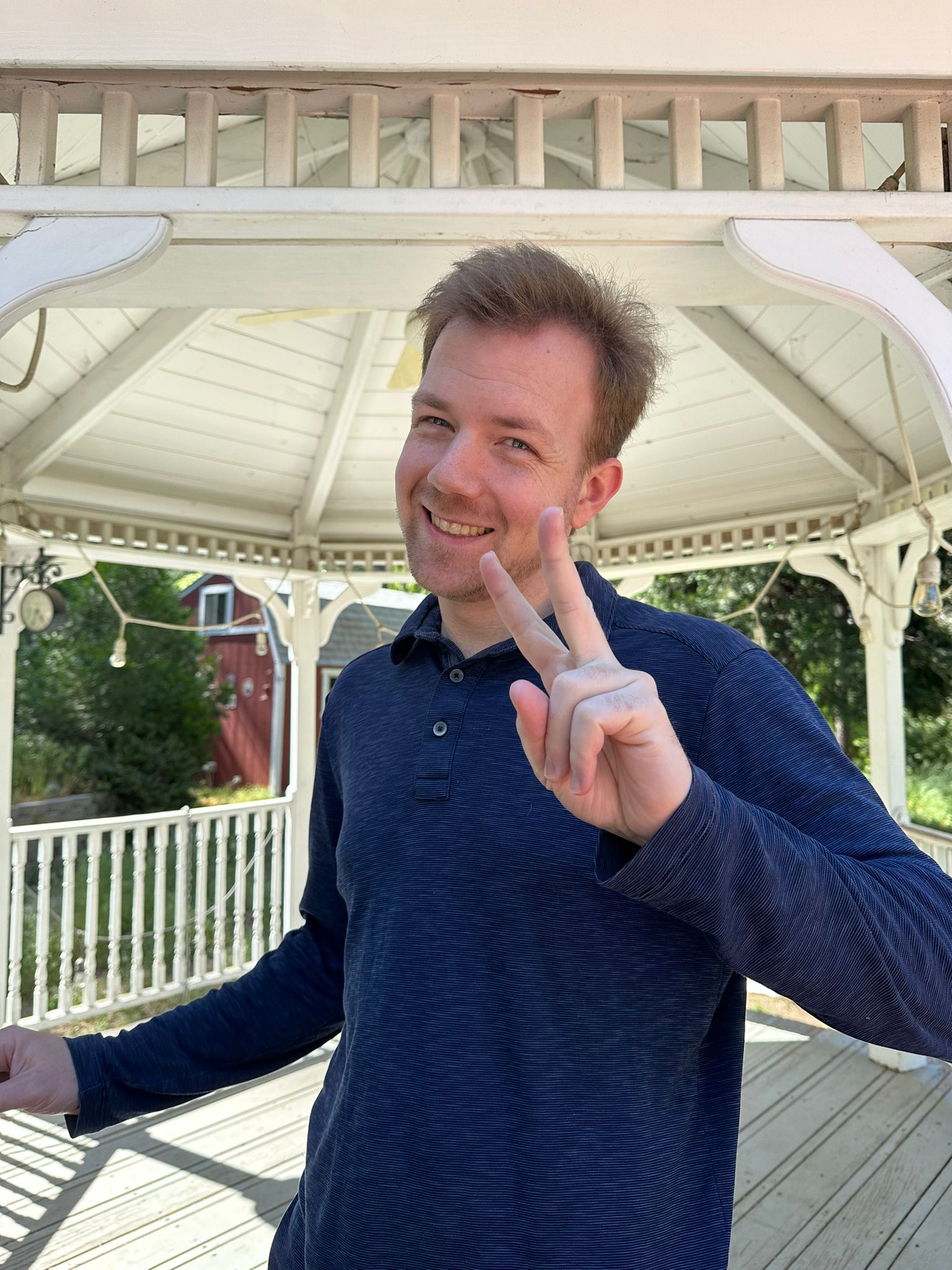 Paul Lingren smiling and making a peace sign