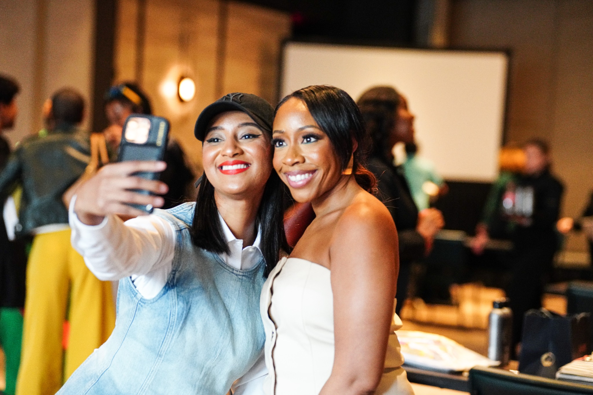 Maya and a client taking a selfie at a past retreat