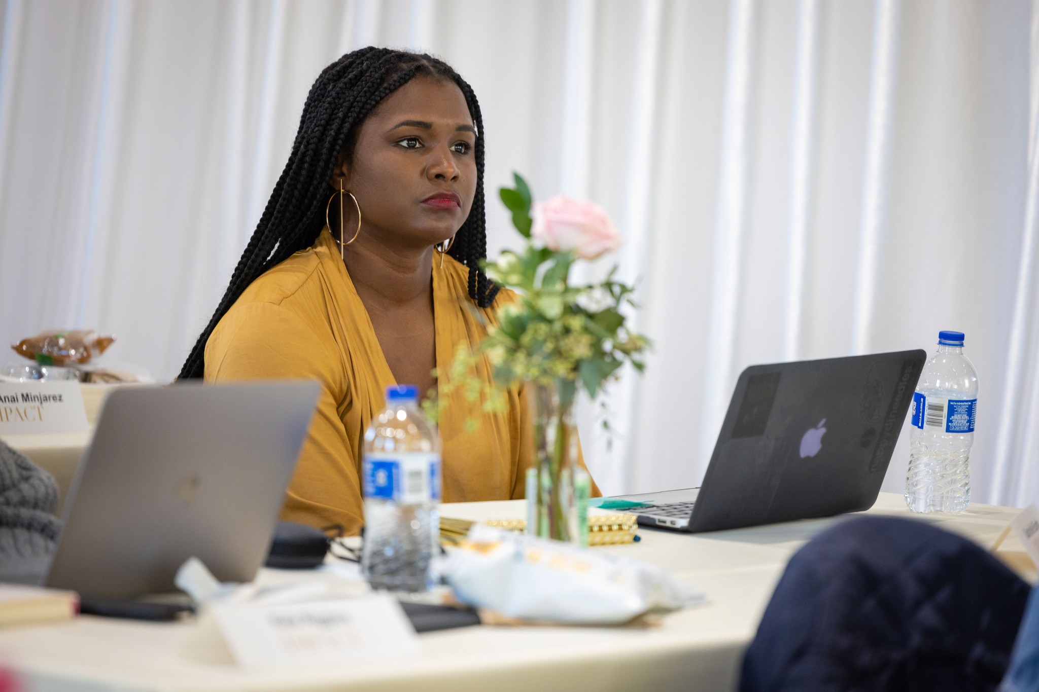 A client working at a laptop during a workshop