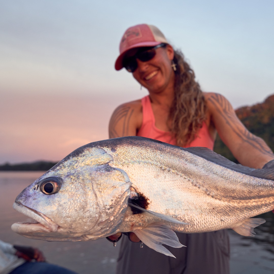 Angler with Silver Drum Catch
